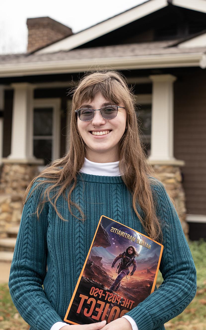 Natalie Martinaitis in front of the Publications House on Washington College's campus